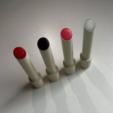 a snap of the line up of four Victoria Beckham Posh Balms