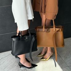 Threadsstyling two woman holding prada buckle bags