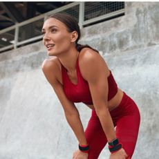 A woman working out outside utilising the many wrist weight benefits